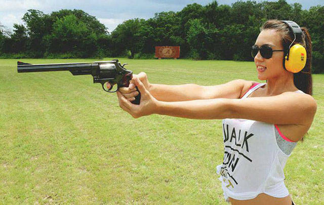 Awesome Girls Holding Big Guns – What Could Be Better?