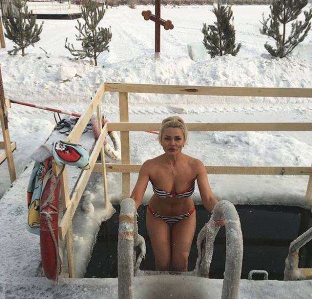 Russian Women Celebrate Orthodox Epiphany By Diving Into Icy Cold Water