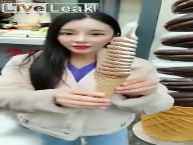 Miniature Asian Girl With A Big Ice Cream
