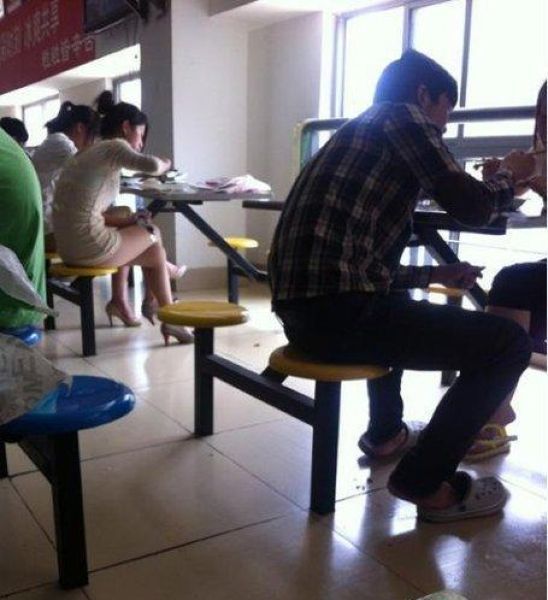 This Chinese Girl Enjoys Her Lunch in Student Cafeteria