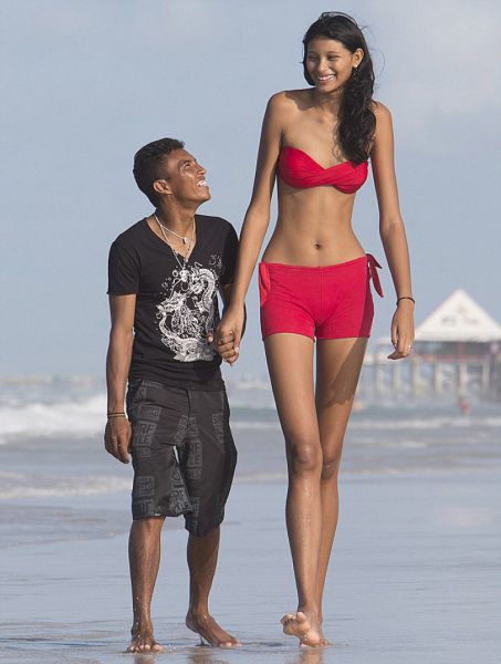 Teen Girl Towers Over Her Lover