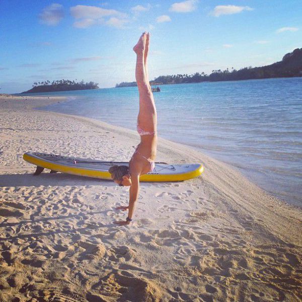 Surfboard Yoga Is a Fun New Form of Beach Exercise