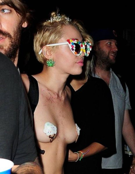Miley Cyrus Parties Topless in Town