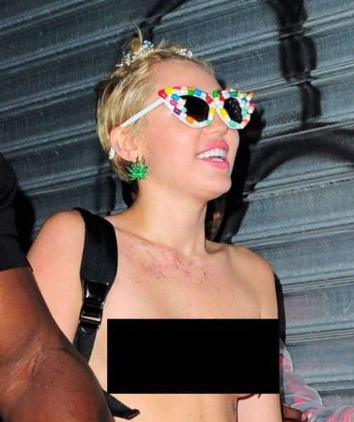 Miley Cyrus Parties Topless in Town