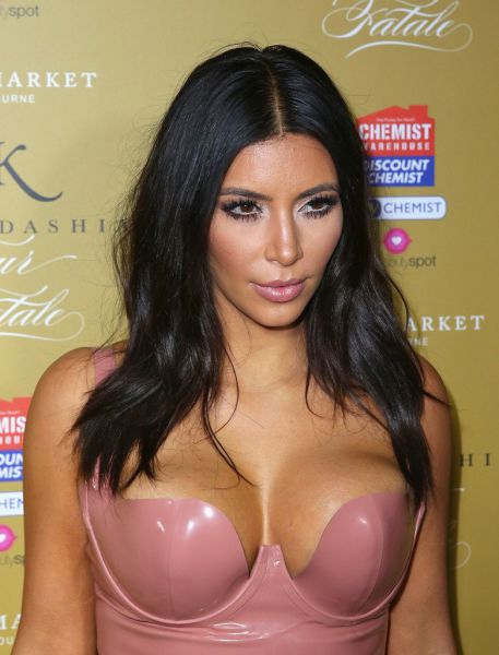 Kim Kardashian Squeezes Her Curves into Pink Latex