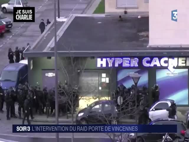 Footage of the Raid on Hostage Takers in Paris Following the Charlie Hebdo Attack 