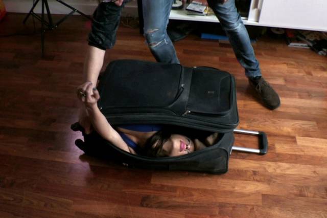 The Girl Who Is So Bendy She Can Pack Her Whole Body into a Handheld Suitcase