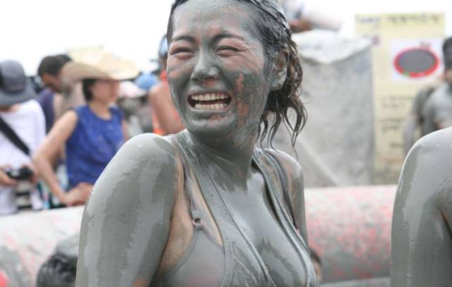 Girls Having Fun At The Korean Mud Festival